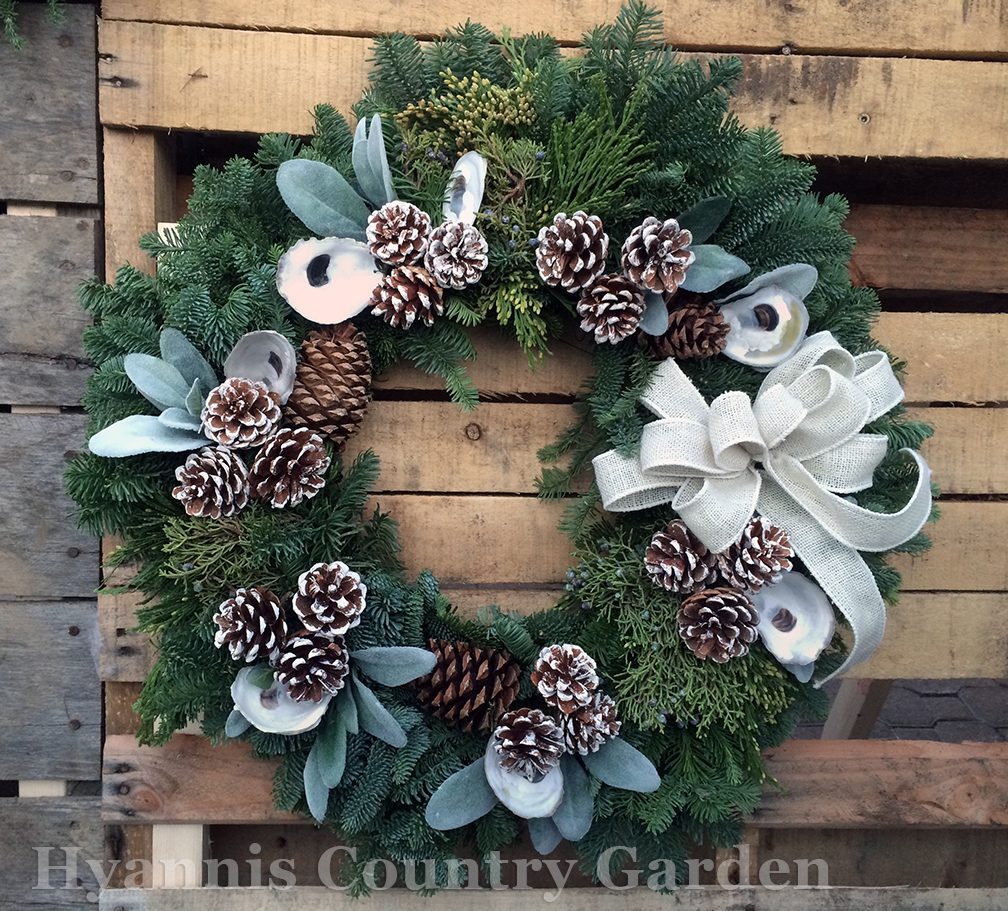 Some of these wreaths include recycled materials. The Oyster Shells on this wreath, for example, were given to us by someone who had harvested and enjoyed local oysters. The shells were cleaned and drilled, going on to a new life as wreath decor.
